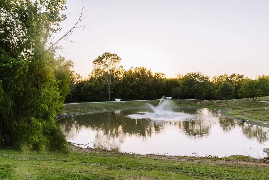 Sugar Hill RV Resort entrance road sign at sunset